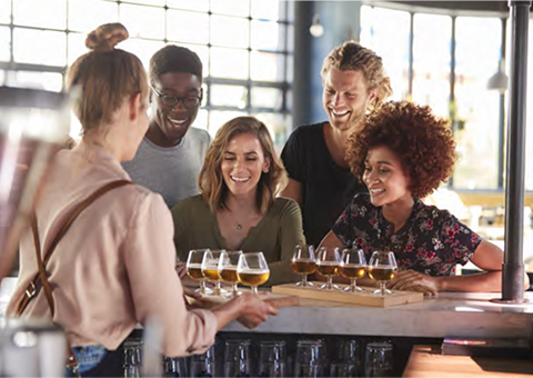 Brewery staff sampling beers at a bar for training